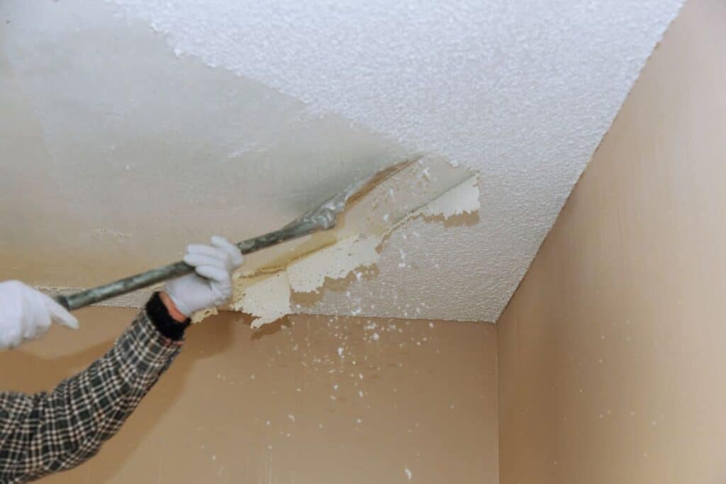 Scrapping a popcorn ceiling.